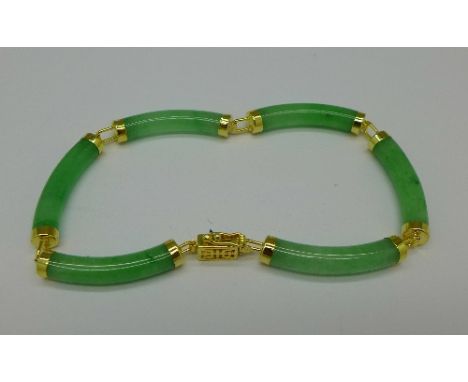 A silver mounted jade bracelet