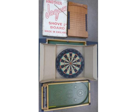 A cased dart board, Jacques shove halfpenny board and a 1970's bagatelle board