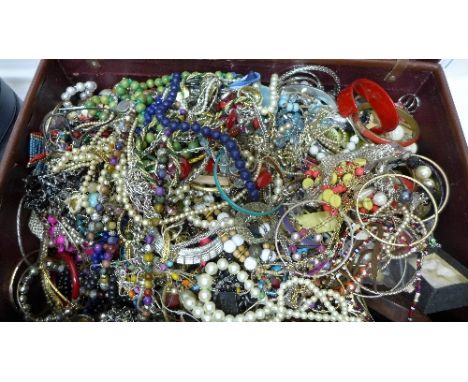A vintage case with costume jewellery, total weight 10kg
