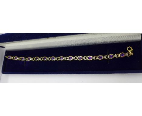 A silver-gilt amethyst bracelet set with fourteen diamonds