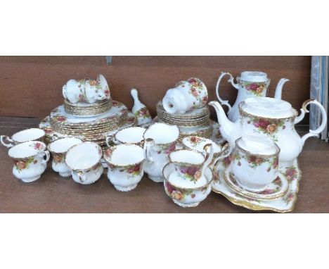 Royal Albert Old Country Roses china; a six setting coffee service with coffee pot, a six setting tea service with teapot (la