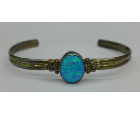 A silver and synthetic opal bangle