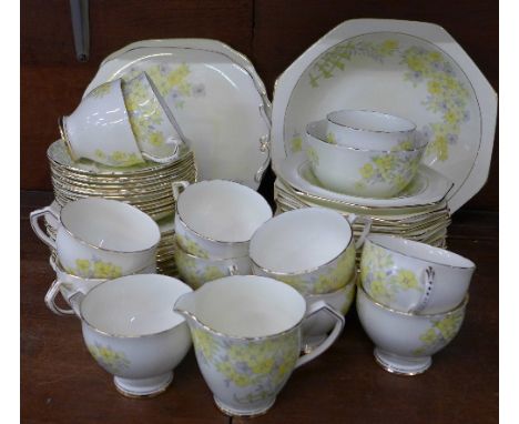 Wellington china teaware and a fruit set; eleven cups, twelve saucers, eleven tea plates, a fruit dish and twelve bowls, two 