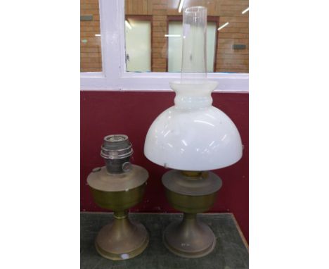 A brass oil lamp and an oil lamp base