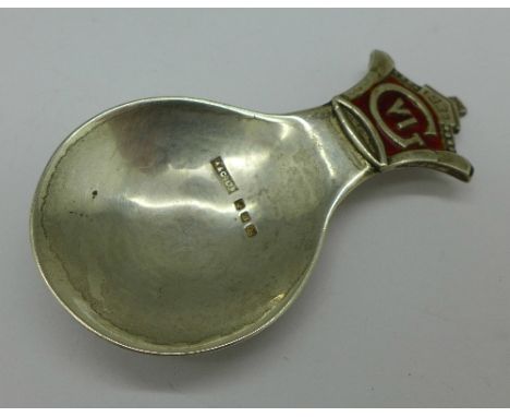 A George VI silver and enamel caddy spoon by Asprey, signed Stone