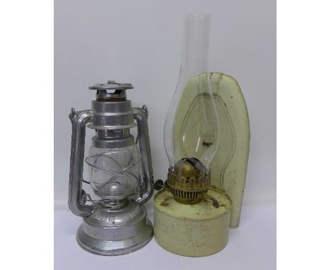 An oil lamp and a hurricane lamp