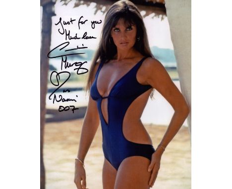 Caroline Munro James Bond actor signed super sexy 10 x 8 inch colour Blue swim suit photo. Rare, inscribed Naomi 007. English