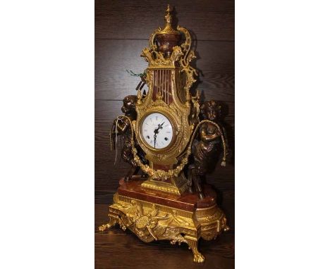 LATE 20TH CENTURY FRENCH STYLE MANTLE CLOCK
with brass lyre body and circular enamel dial, stamped Imperial Made in Italy, an