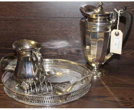 GROUP OF SILVER AND PLATED WARE
including a silver toast rack and a silver ladle, along with a plated coffee pot, serving tra