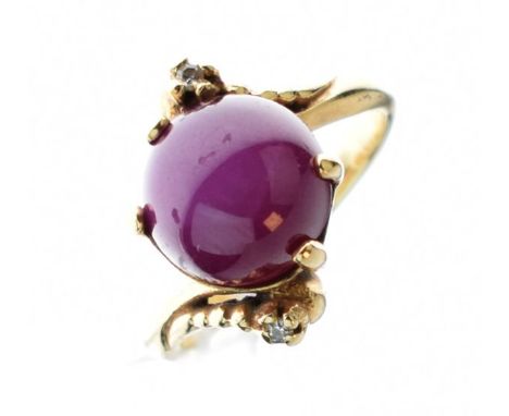 Synthetic star ruby set dress ring, the crossover shank stamped 14k, size M   Condition: 