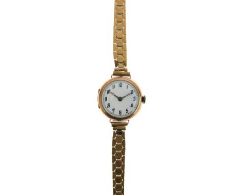 Lady's 9ct gold cased wristwatch, the white enamel dial with Arabic numerals   Condition: 