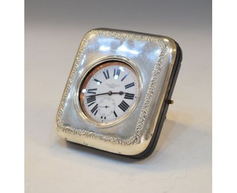 Late 19th/early 20th Century embossed silver easel watch case, hallmarks indistinct, containing a nickel plated cased Goliath