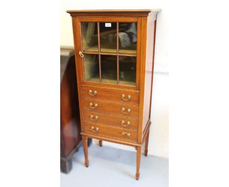 Edwardian mahogany and line inlaid music cabinet, the single bar glazed door with single shelf above four drawers, on square 