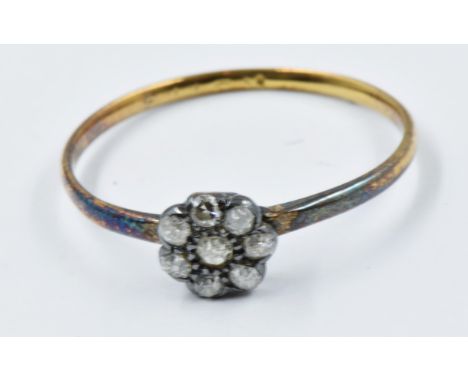 Small seven stone diamond set flowerhead ring 