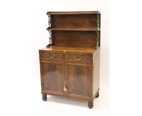 Small George IV mahogany chiffonier with a two tier shelf back supported by ormolu uprights above a fold-out top, two drawers