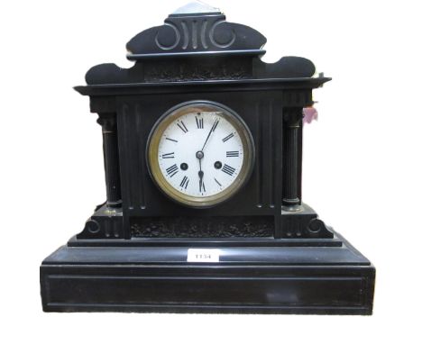 19th Century French black slate mantel clock, the enamel dial with Roman numerals and two train movement, 37cm high 