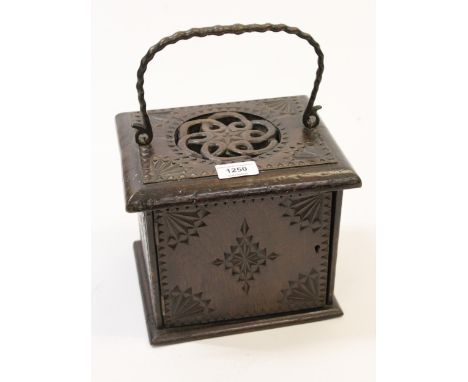 Unusual small antique carved oak box with a pierced top, iron carrying handle and single panel door, 22cm wide 