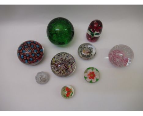 Box containing a collection of nine various paperweights, including Caithness and Millefiori 