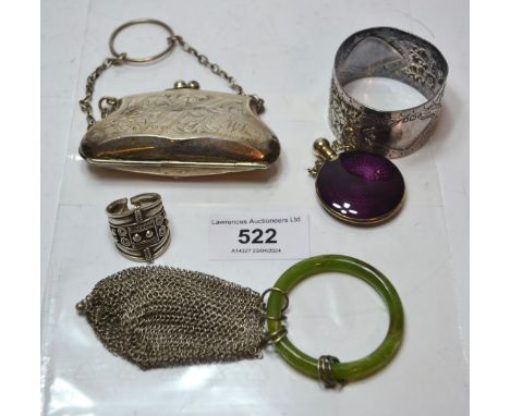 Small silver purse, silver napkin ring, an enamel decorated perfume bottle, silver ring and a wire mesh purseSome slight dent