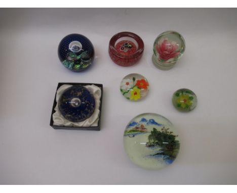 Box containing a collection of seven various paperweights including Caithness, Selkirk glass etc.Some minor surface wear/scra