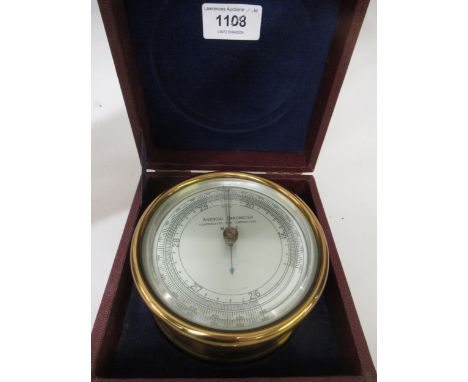 Negretti & Zambra, circular gilt brass cased aneroid barometer inscribed ' Mark I ', together with another similar unnamed ba