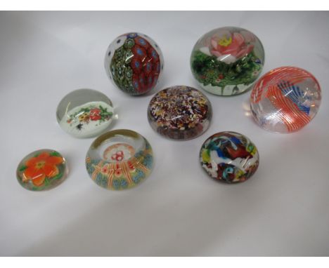 Box containing a collection of eight various paperweights, including Caithness and Millefiori 