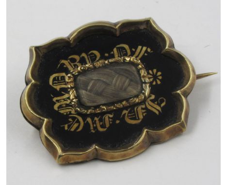 Victorian yellow metal and black enamel hair inset memorial broochThis is not marked, looks to be 9ct. The pin is not gold. 5