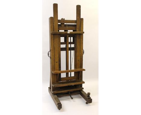 Winsor & Newton faux oak painted pine ' Improved studio easel ' sold by All Artists Colourmen & Co., bearing label (currently