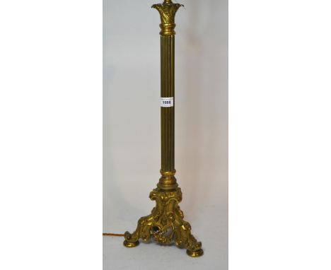 Brass column form lamp base on decorative gilt brass triform base, 66cm high 