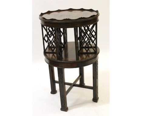 Unusual 20th Century mahogany circular Chippendale style revolving bookcase on blind fretwork square chamfered supports with 