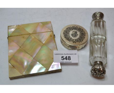 Circular white metal compact inscribed ' Baghdad', together with a Victorian double ended glass scent bottle with white metal