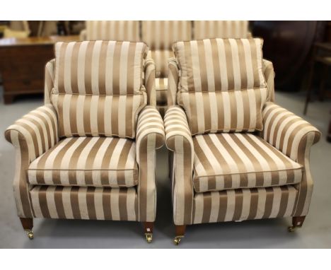 Modern three piece sitting room suite by Duresta comprising:  sofa and two armchairs, in striped upholstery raised on low squ