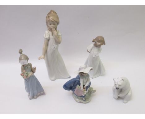 Three various Lladro figures, together with two Nao figures 