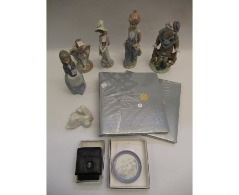 Group of three various Lladro figures including a nun and children praying, together with two Nao figures and two Lladro leat