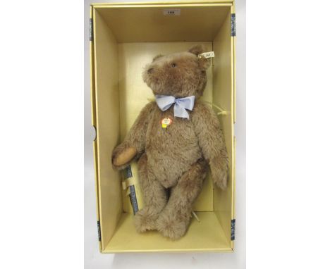 Large modern Steiff 1996 teddy bear of a 1951 replica with certificate, having blue bow tie in original box, 48cm high 