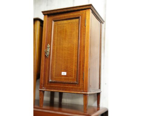 Edwardian mahogany and chequer line inlaid bedside cabinet with a single panel door on low square tapered supports, 43cm wide