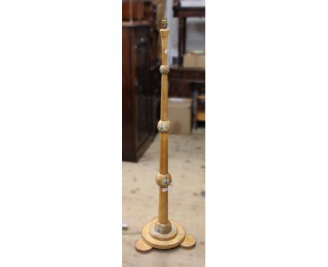 Art Deco beechwood standard lamp with floral decoration on a tapering knopped baluster column 