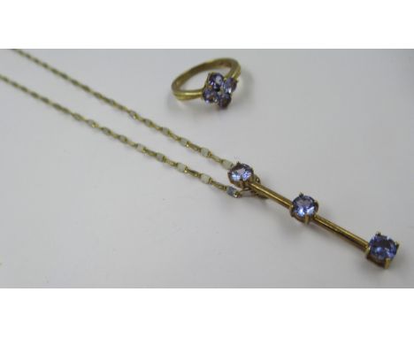 9ct Gold dress ring set four tanzanites, size J, together with a similar tanzanite set pendant necklace, gross weight 6.0g 