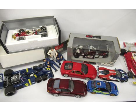 Two mint boxed 1/18th scale die cast metal model racing cars of Lotus 49B by A Model and UT models of an Opal Calibra racing 