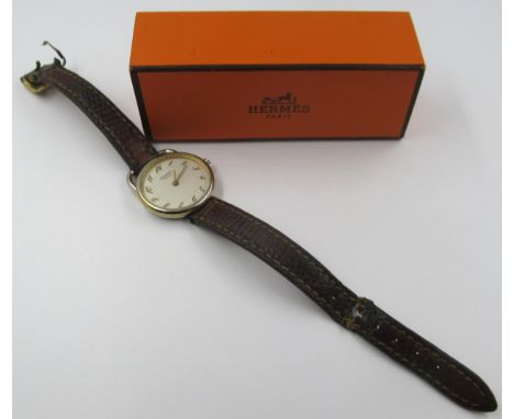 Hermes, ladies circular wristwatch with a brown leather strap, in a Hermes box 