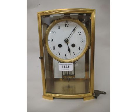 19th Century French two train clock, the circular enamel dial with Arabic numerals, striking on a bell with mercury compensat