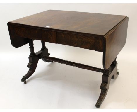 19th Century mahogany sofa table, having two frieze drawers with twin turned column end supports, and carved splayed supports