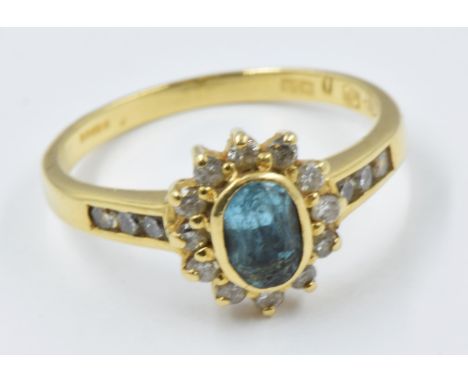 18ct Yellow gold blue topaz and diamond set ring 