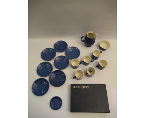 Moorcroft blue glazed part coffee service comprising:  six coffee cans (one at fault), six saucers, sugar bowl, a small sauce