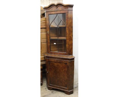 Reproduction burr elm floor standing corner cabinet, with glazed shelved top and single panel door, on bracket feet, 195cm hi