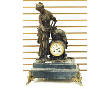 19th century French mantel clock with spelter figure, raised on a platform base, with splayed legs, height 56cm 