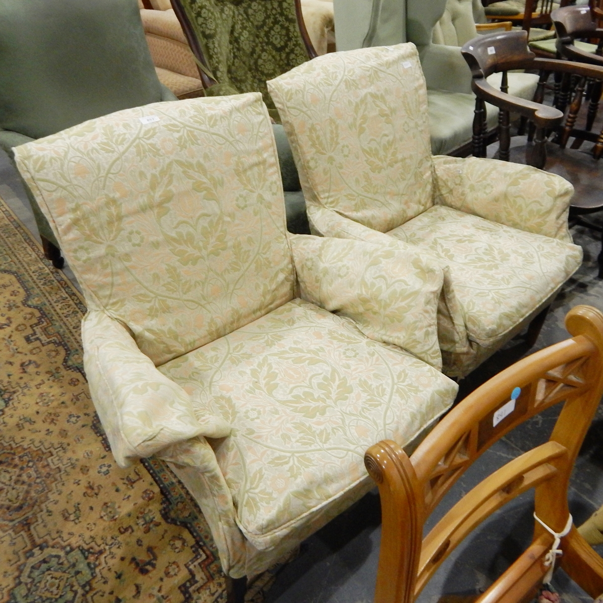 Pair of Parker Knoll upholstered armchairs with fitted loose covers (2)