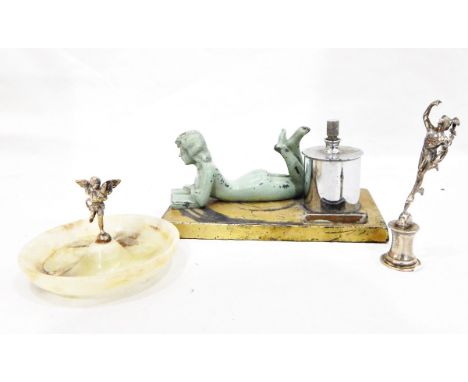 Art Deco- style table lighter surmounted by green painted figure of girl reading a book, silvered model of Hermes and an alab