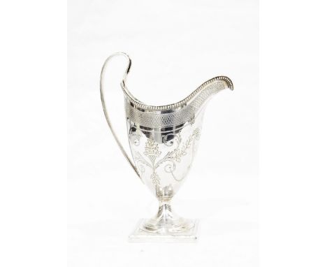 George III silver cream jug by Peter & Ann Bateman, London 1796, of helmet form, engraved with foliate scrolls and with a cen