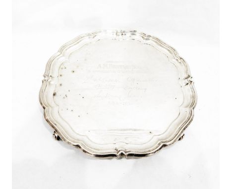 Silver salver by Harrison Bros & Howson, Sheffield 1950, of shaped circular form, on four scroll feet with presentation inscr